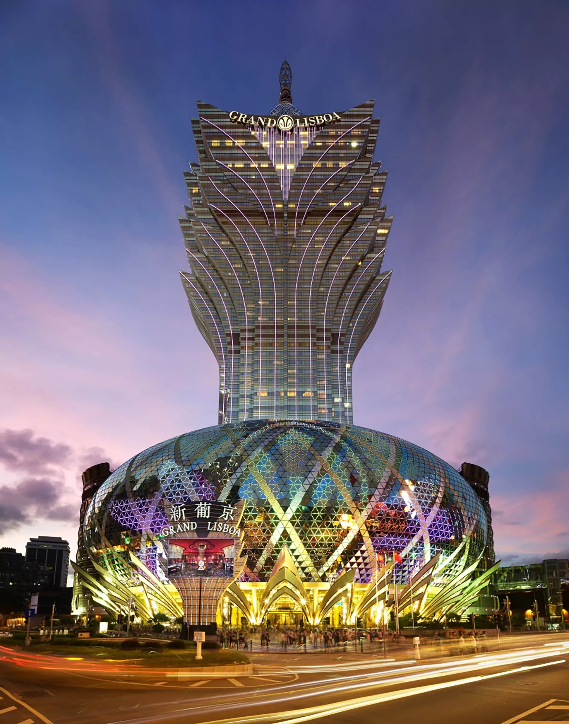 An exterior view at dusk of the Grand Lisboa Hotel and Casino