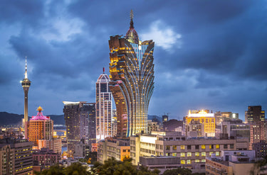 A night time view of the Grand Lisboa Hotel and Casino made to stand out as a beacon to all by Huayi's lights.